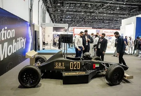 Students from Abu Dhabi University exhibit a 160 mph F1 electric vehicle at Automechanika Dubai